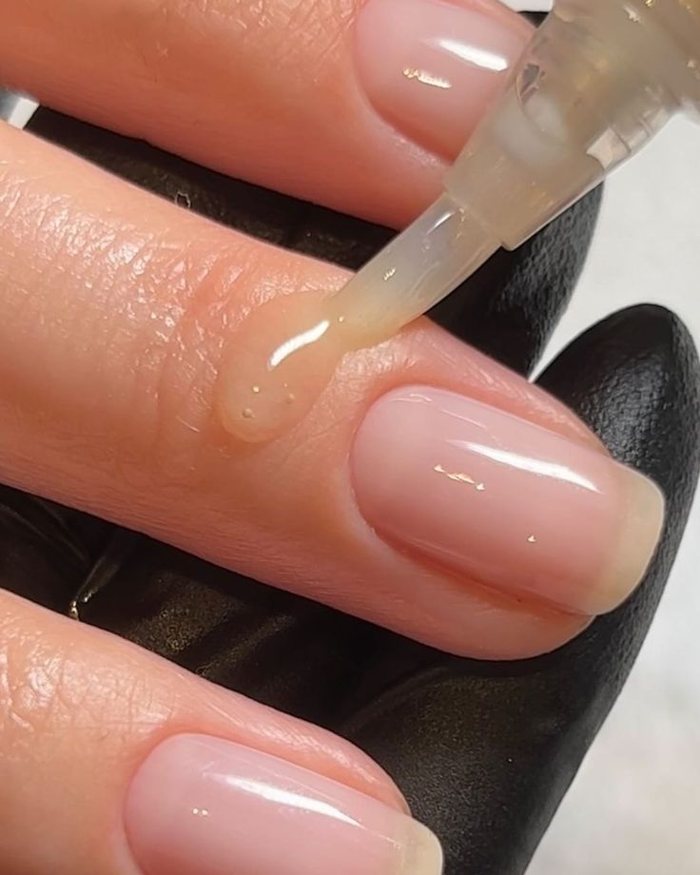 Natural nails with cuticle oil after a Russian manicure